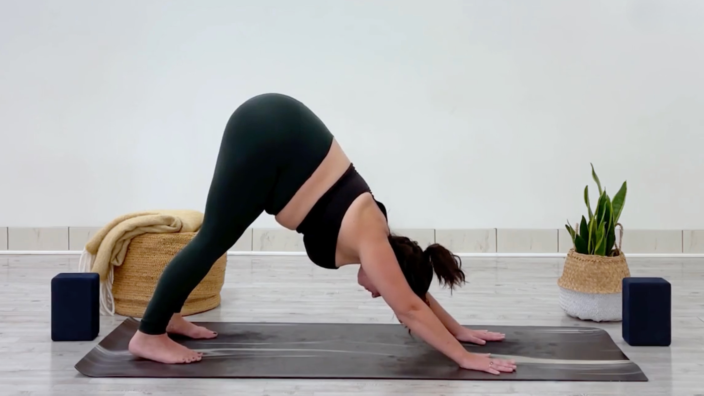 Yoga teacher Taylor Lorenz in Downward-Facing Dog, part of her yoga for balance practice